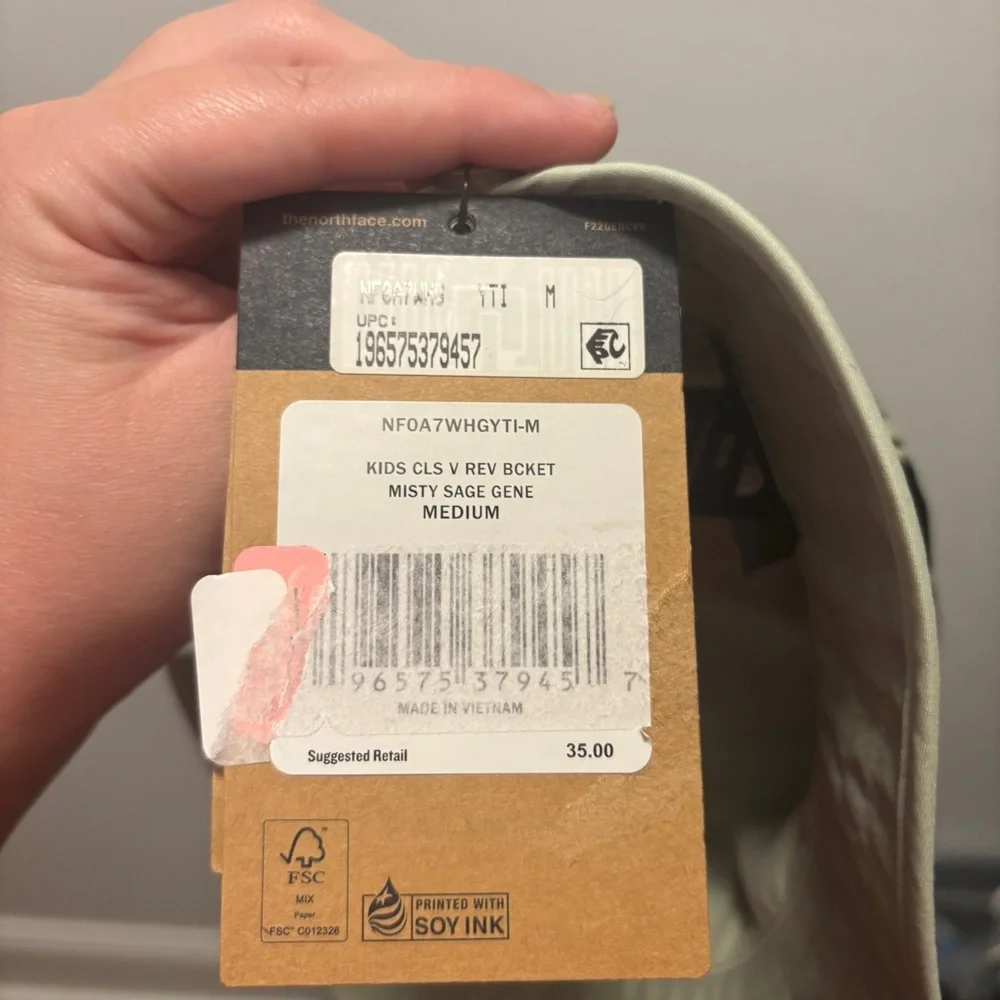 The North Face Kids Bucket Hat in Black and Olive Camo
